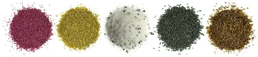 Colored powder piles in a row.